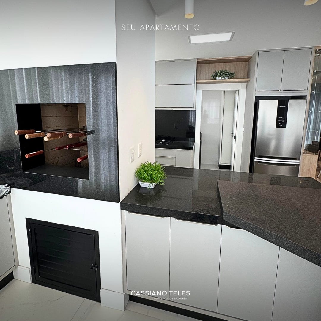 Varanda gourmet com churrasqueira do apartamento à venda Itapema no Carmel Residence.