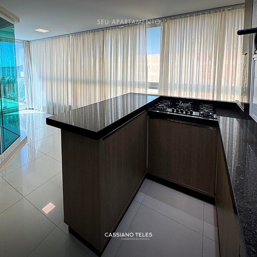 Varanda gourmet com churrasqueira no Residencial Cayman em Itapema.